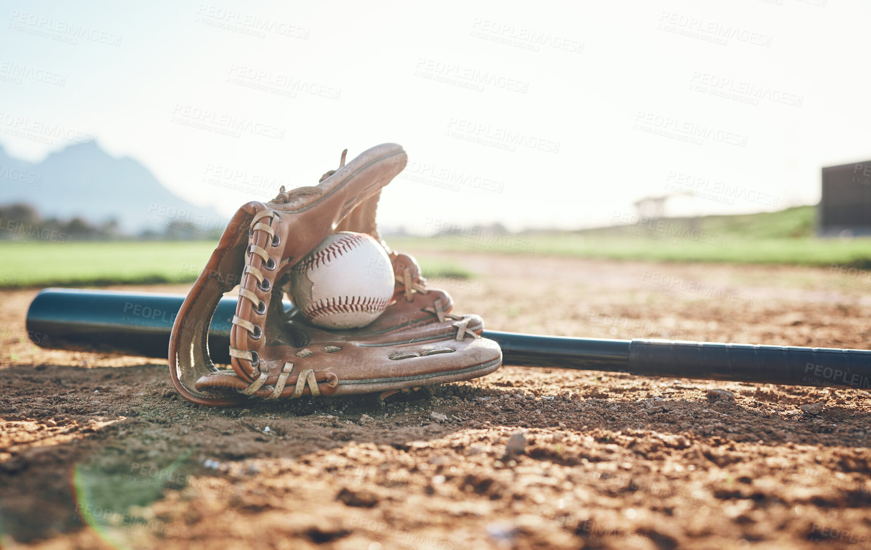 Buy stock photo Glove, bat and baseball gear on a field for a game, professional competition or sports. Ground, fitness and equipment for a match, fitness or training for softball on the sand in summer for cardio