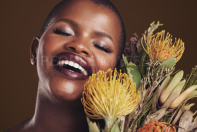 Buy stock photo Skincare, nature and plant with the face of a black woman in studio on brown background for natural treatment. Beauty, protea or cosmetics and a young model for aesthetic wellness with flowers