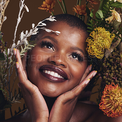 Buy stock photo African woman, plants and thinking for aesthetic in studio with flowers for beauty, wellness and glow by brown background. Girl, model and smile on face for idea, leaves or memory with skin cosmetics
