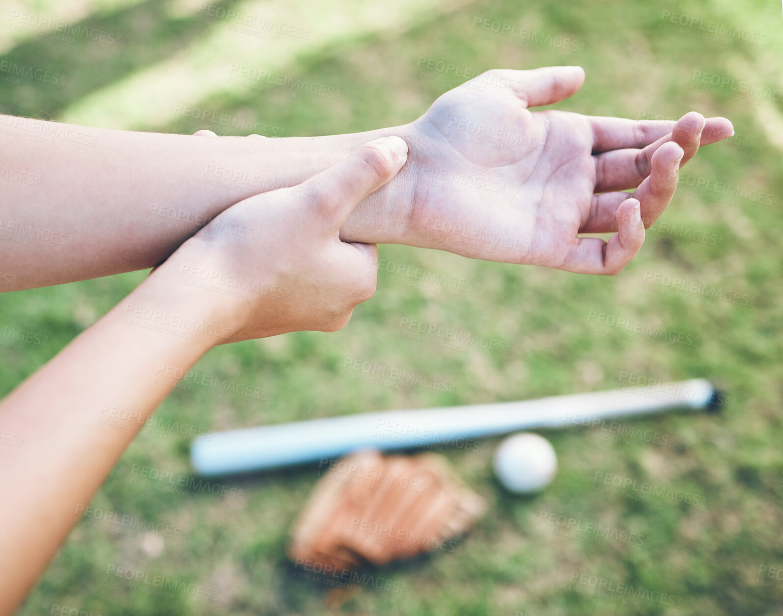 Buy stock photo Above, field and hand pain from baseball, sports and training for a competition with an injury. Fitness, burnout and a person or athlete with a muscle accident or arm strain after a softball match