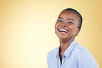 Portrait, smile and happy black woman confident with beauty isolated in a studio yellow background. African, fashion and relax young person proud of style laughing at joke with joy, humor and fun