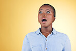 Surprise, wow or face of black woman in studio on yellow background amazed by retail discount deal. Wtf, omg or mind blown person shocked by sale offer, promotion or news announcement with mouth open