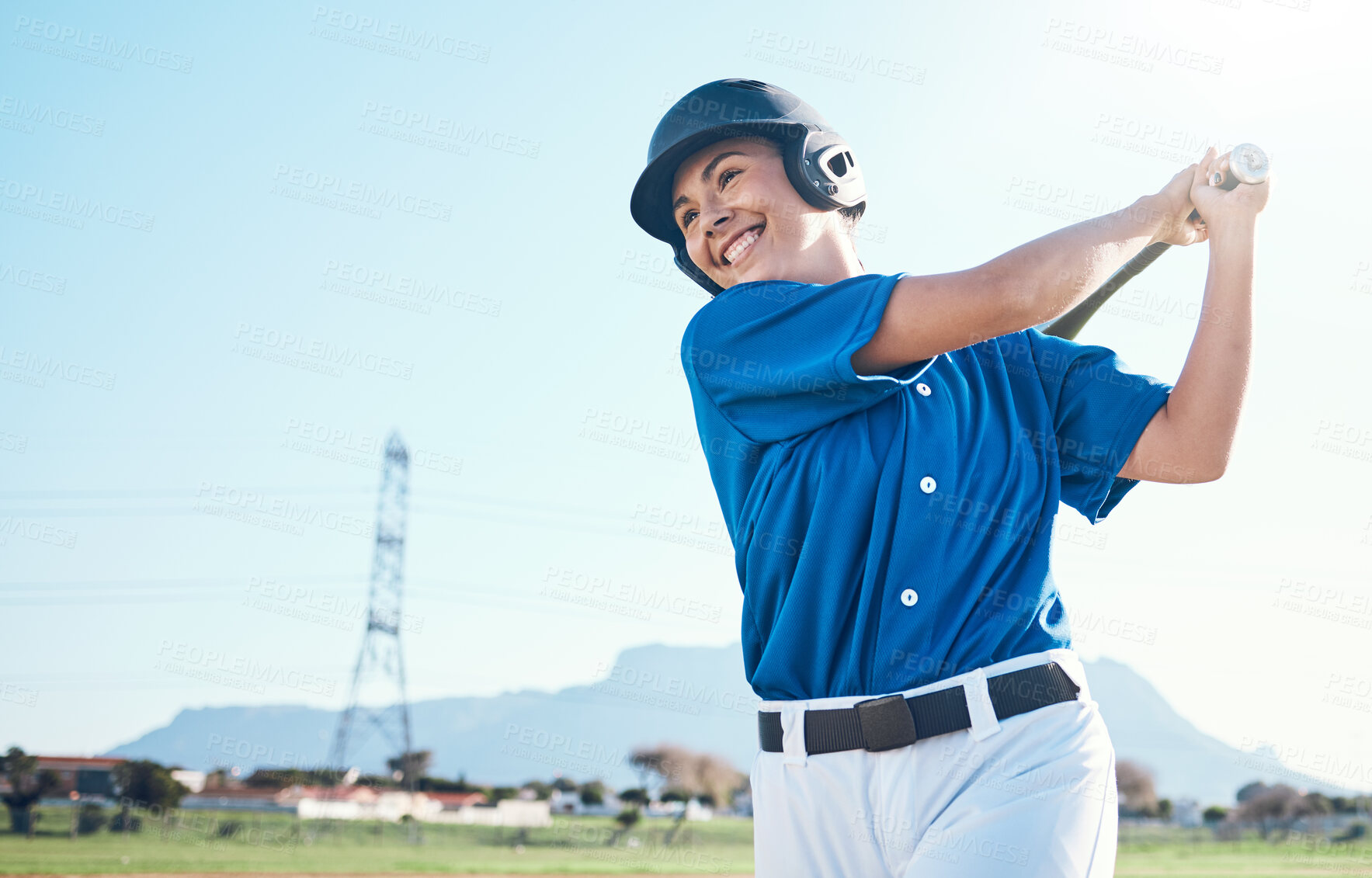 Buy stock photo Baseball, bat and swing of a woman outdoor on a pitch for sports, performance and competition. Professional athlete or softball player with a smile, space and ready for game, training or exercise