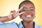 Happy, peace sign and face of black woman in studio smile for confident, excited and beauty. Emoji, hand gesture and African person on yellow background with cosmetics, makeup and glamour for freedom