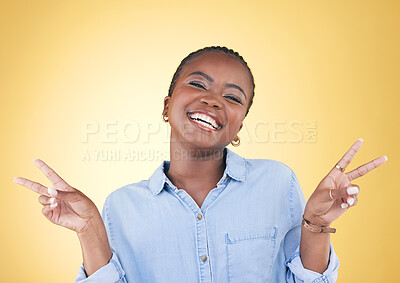 African woman, peace sign and studio portrait with smile, excited face and trendy clothes by yellow background. Young fashion model, happy or student with hand, icon or emoji with vote for opinion