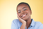 Happy, black woman and skincare, touch and beauty in studio isolated on a yellow background mockup space. Smile, natural and African model in cosmetic facial treatment, health aesthetic and wellness