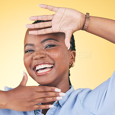 Buy stock photo Hands, face frame and portrait of black woman in studio for confidence, creativity and beauty. Photography, perspective and happy African person on yellow background in cosmetics, makeup and glamour