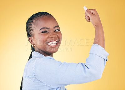 Buy stock photo Portrait, black woman and flex for power, smile and challenge on a yellow studio background. Face, happy person and model with strength, arm muscle and achievement with success, confident and winning