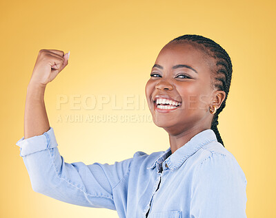 Buy stock photo Portrait, strong and black woman flex for power, achievement and challenge on a yellow studio background. Face, happy person and model with strength, arm muscle and success with confidence or winning