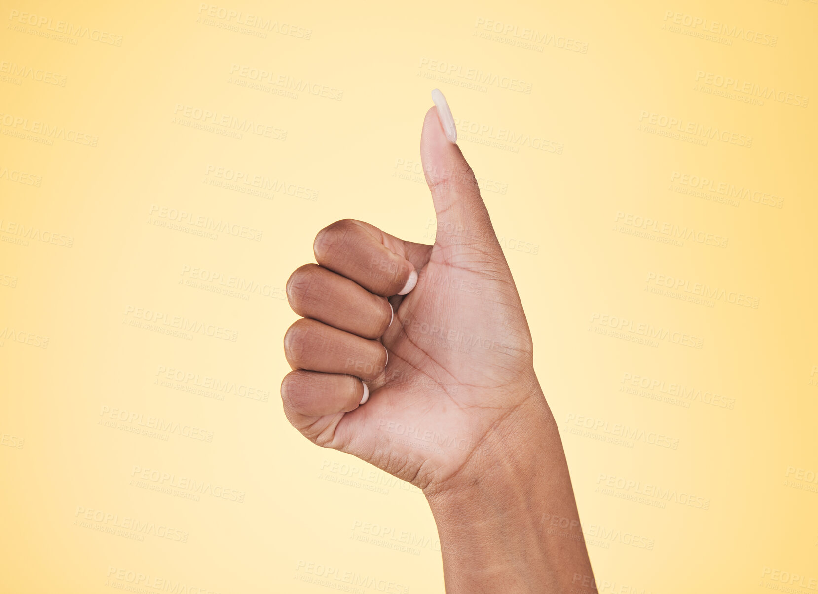 Buy stock photo Woman, hands and thumbs up in winning, success or approval against a studio background. Closeup of female person with like emoji, yes sign or okay in thank you, agreement or finger gesture on mockup