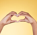 Woman, heart hands and symbol for love, support or care in trust against a studio background. Closeup of female person with loving emoji, gesture or sign in romance, valentines day or shape on mockup