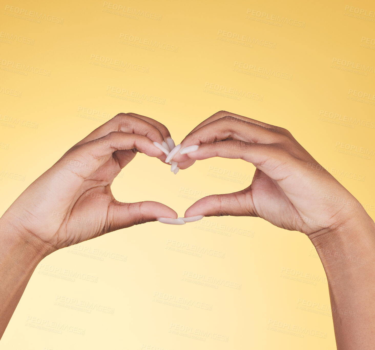 Buy stock photo Woman, heart hands and symbol for love, support or care in trust against a studio background. Closeup of female person with loving emoji, gesture or sign in romance, valentines day or shape on mockup