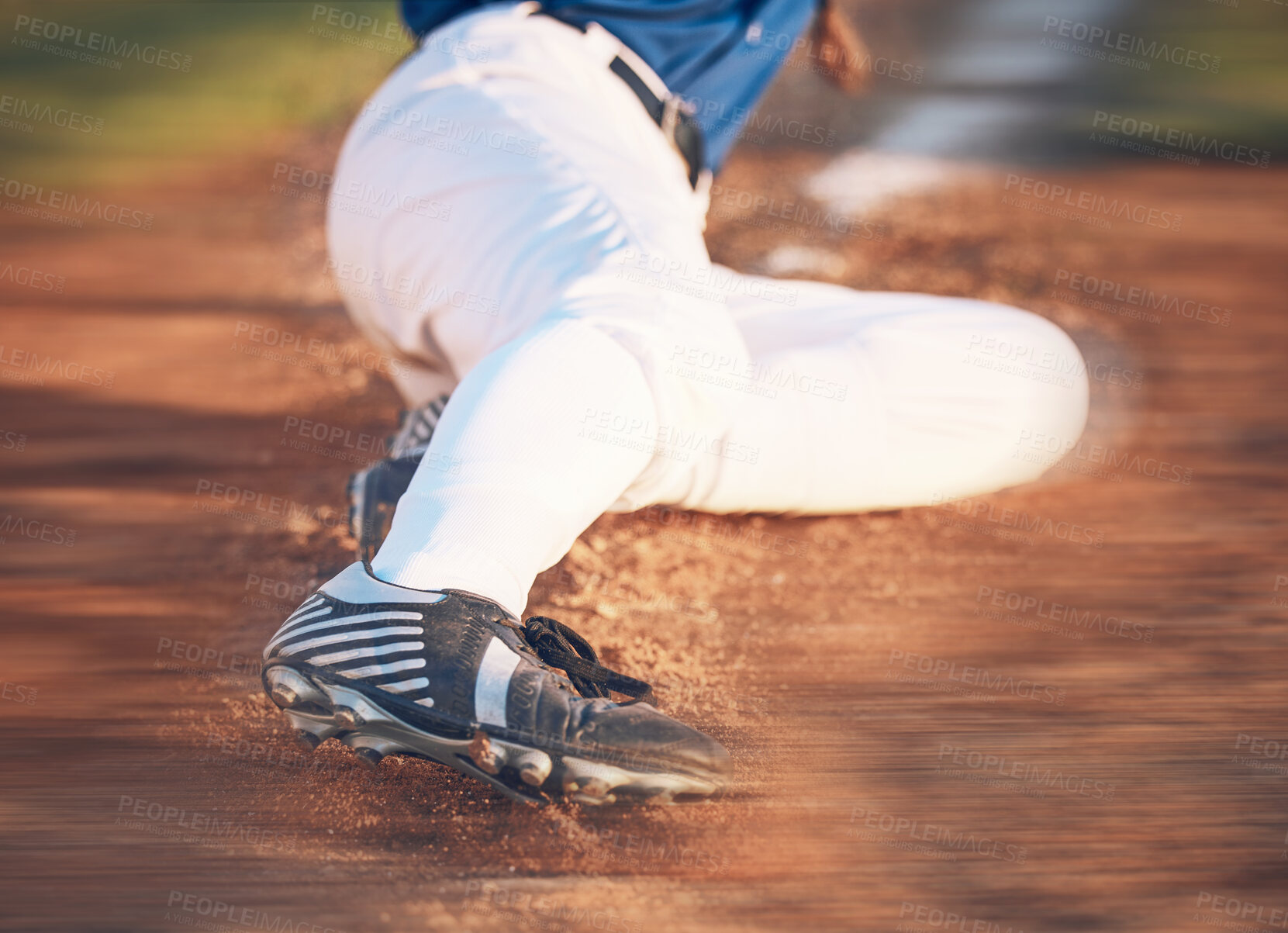 Buy stock photo Slide, baseball action and athlete in a dirt for game or sports competition on pitch in stadium. Person, ground and  tournament performance by athlete or base runner in training, exercise or workout