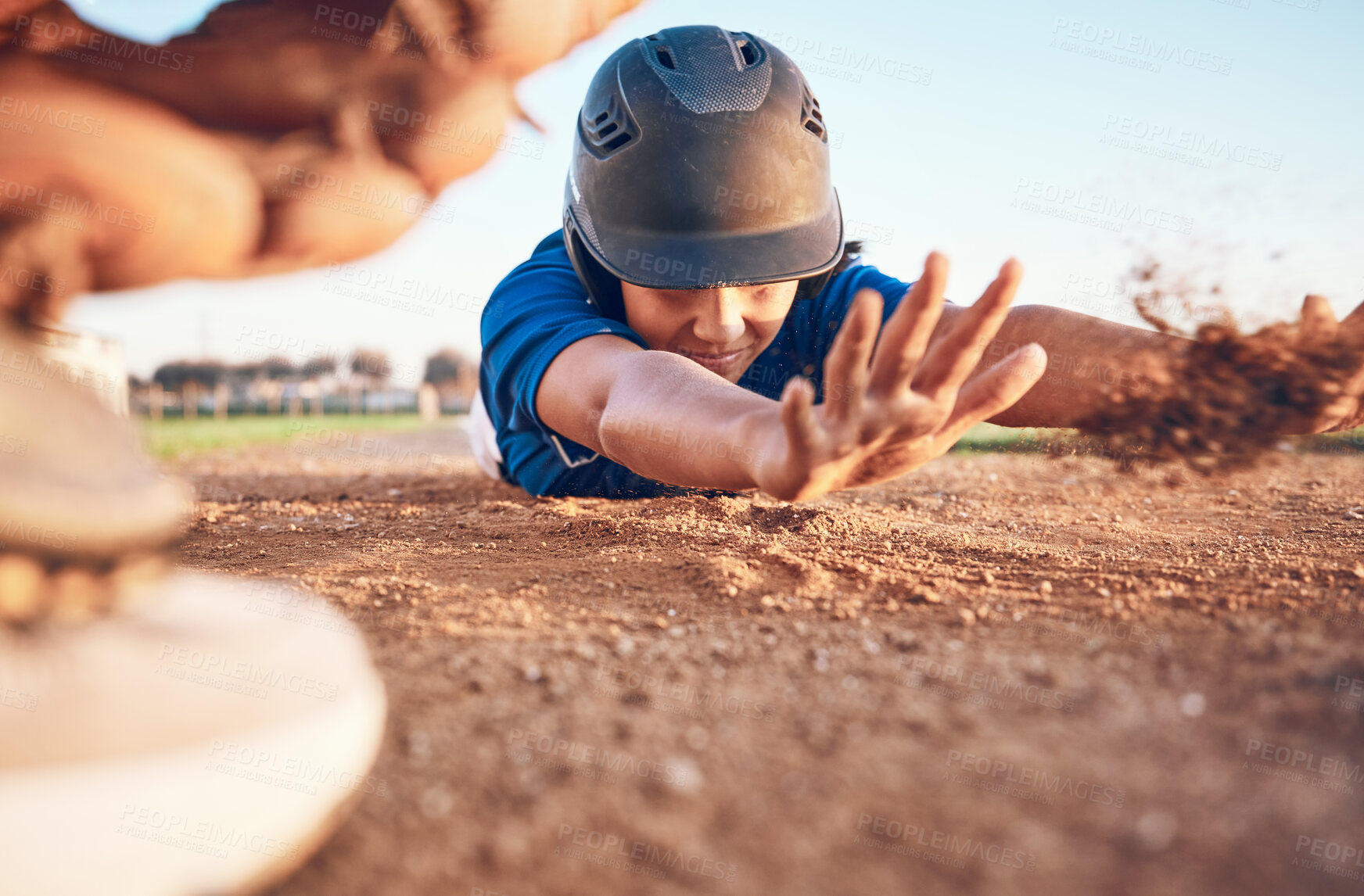 Buy stock photo Slide, baseball action and player in a match or game for sports competition on a pitch in a stadium. Man, ground and  tournament performance by athlete or base runner in training, exercise or workout