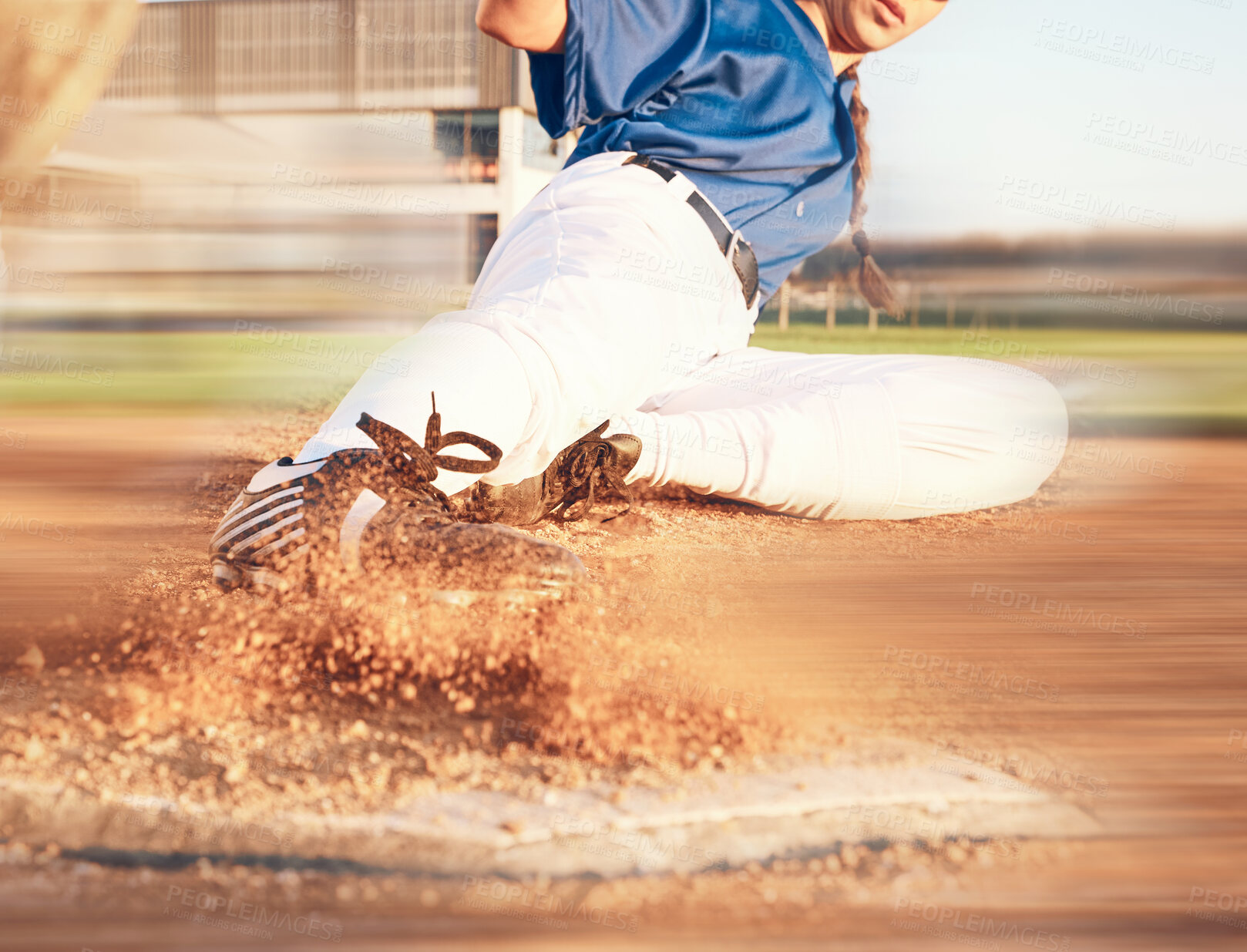 Buy stock photo Slide, softball action and player in match or game for sports competition on a pitch in a stadium. Goal, ground and  tournament performance by athlete or base runner in training, exercise or workout