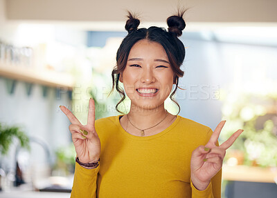 Buy stock photo Peace, hands and portrait of Asian woman in home with happiness, v sign or gen z person in kitchen, living room or apartment. Happy, girl and unique fashion in house with confidence and smile on face