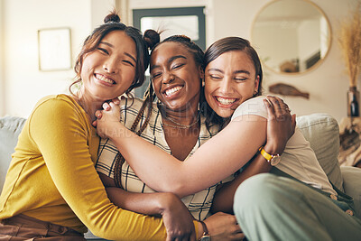 Buy stock photo Portrait of a group of women, friends hug on sofa with smile and bonding in living room together in embrace. Hug, love and friendship, girls on couch with diversity, pride and people in home with fun