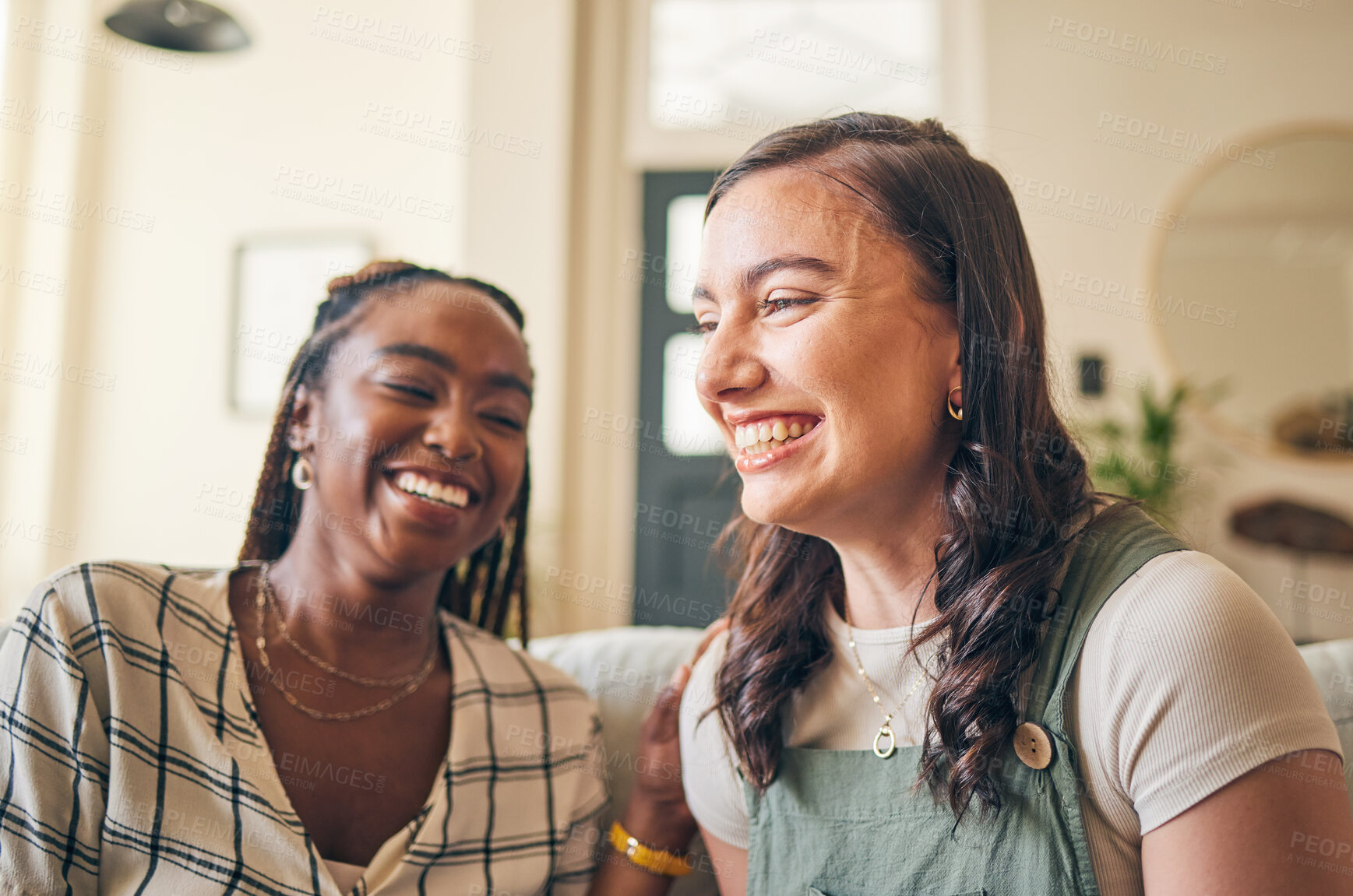 Buy stock photo Happy, funny and friends with women on sofa for relax, bonding and conversation. Smile, support and happiness with people laughing in living room at home for gossip, chat and discussion together