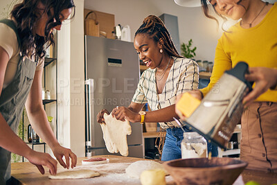 Buy stock photo Cooking, friends and food with women in kitchen for pizza, support and nutrition. Happy, bonding and help with group of people and preparing lunch at home for conversation, diversity and health