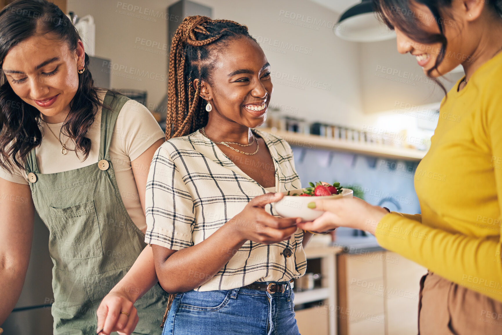 Buy stock photo Women, friends and eating fruit in home for bonding, nutrition and happy lunch together. Healthy diet, sharing and wellness, fresh summer food for friendship and girls in kitchen with smile at party.