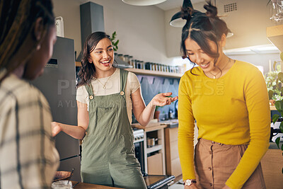 Buy stock photo Conversation, bonding and girl friends in the kitchen of their new apartment having fun together. Happy, smile and group of young women talking and cooking a meal for lunch or dinner in a modern home