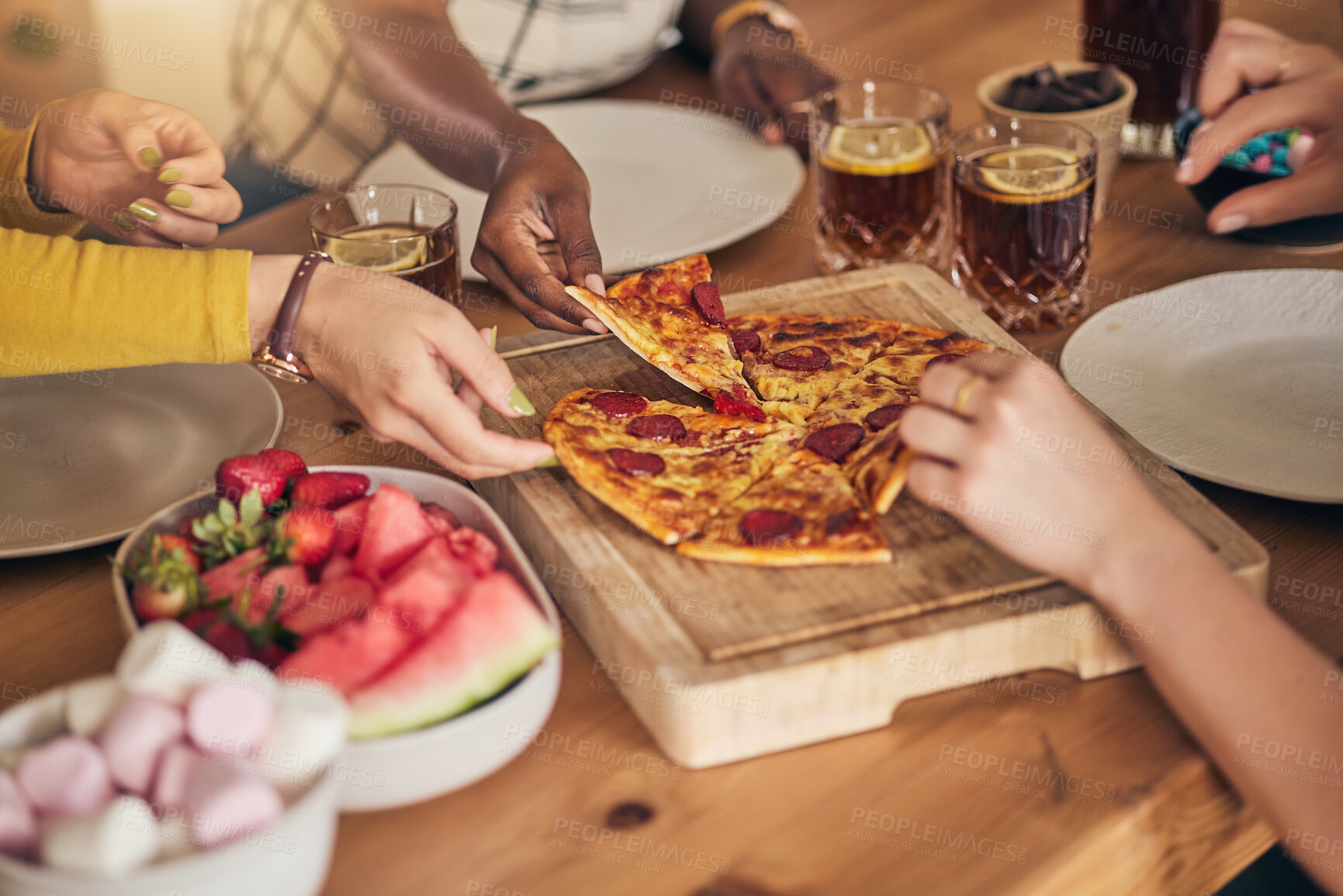 Buy stock photo Food, drinks and pizza, hands with people, dinner on wooden table with snacks for eating and nutrition. Italian cuisine, fruit and sweets with social gathering, meal together and hungry with party
