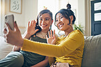 Phone, wave and friends on video call on sofa, communication and conversation in living room of home. Smartphone, hello and happy women in webinar, virtual chat and girl in online meeting in house