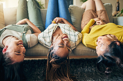 Buy stock photo Upside down, friends and relax on sofa together with head hanging on couch and smile with happiness in home on weekend. Group, diversity and women laughing in fun, bonding or laying on chair in house