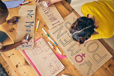 Buy stock photo Girl group, sign and writing for protest, top view and support for diversity, power and goals in home. Women friends, cardboard poster and design with billboard for justice, human rights or inclusion