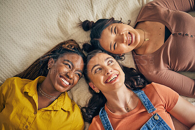 Buy stock photo Group of women, friends on bed with smile and bonding in living room together from above. Happiness, care and friendship, girls relax in bedroom with diversity, pride and people in home with fun.