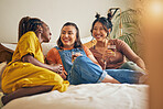 Friends, conversation and women with drink in home for relaxing, bonding and talking together. Friendship, happy and group of people laughing for relationship, visit and chat on sofa in living room