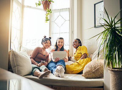 Buy stock photo Home, friends and women with a tablet, connection or smile with live streaming, online reading or social media. App, group or happy people on a couch, technology or bonding with communication or chat