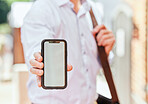 Hand, phone and mockup with a business man in the city on his morning commute into work closeup. Mobile, app or communication with an employee showing blank space on a screen or display outdoor