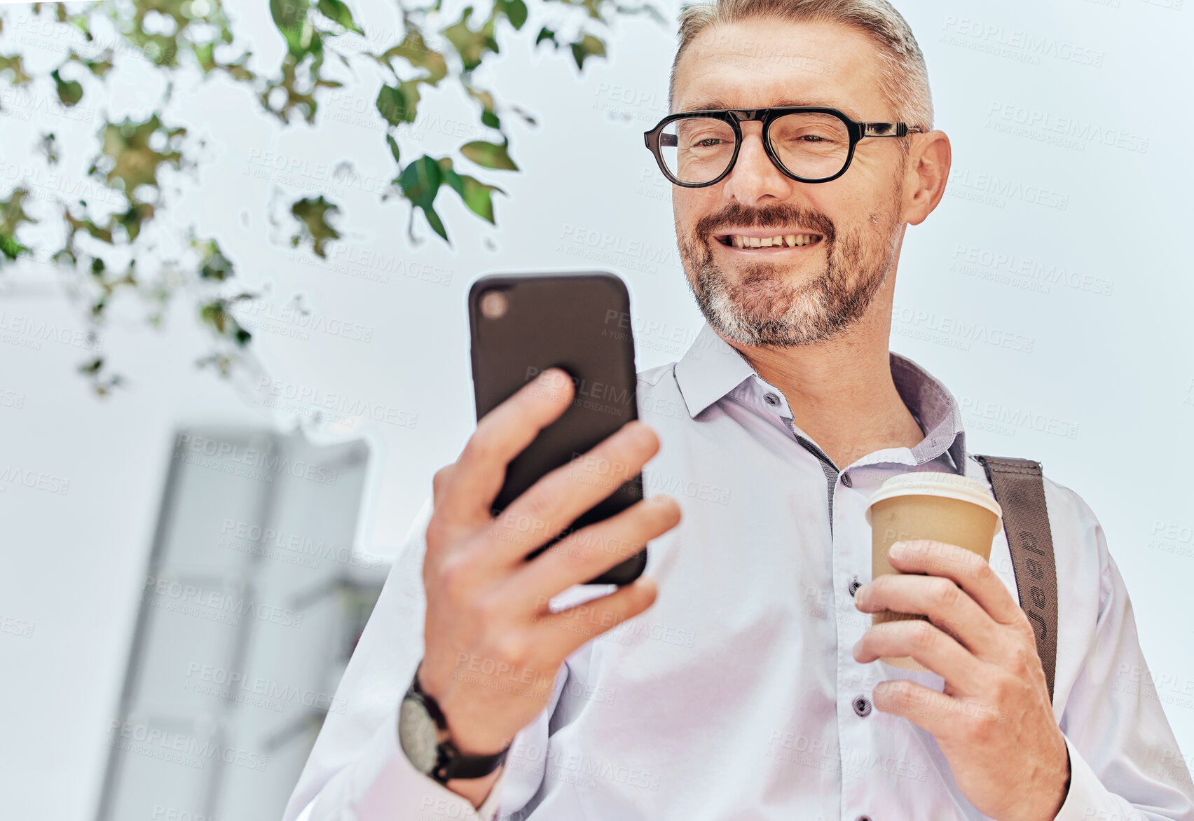 Buy stock photo City, smile and a businessman with a phone and coffee for morning travel, communication or a chat. Happy, executive and a mature employee reading a conversation on a mobile from an app with a drink