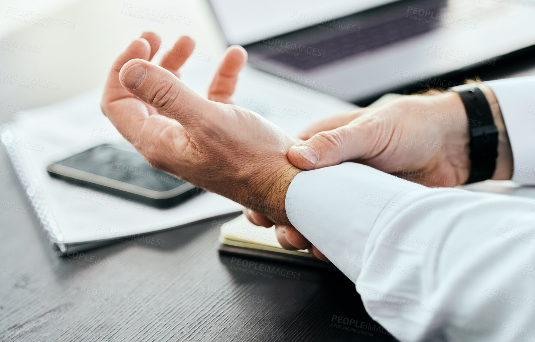 Buy stock photo Business, wrist pain and hands of man in office holding for injury, inflammation and joint strain. Stress, medical emergency and closeup of worker with problem, crisis and carpal tunnel for writing