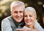 Smile, portrait and senior couple hug at a park with love, free and enjoy travel, holiday or weekend. Face, happy and elderly man embrace woman in forest, bond and fun on retirement trip together