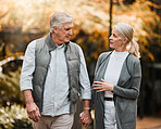 Love, park or couple holding hands, walking and enjoy time together, relax conversation and nature. Wellness, marriage and elderly people on romantic date, outdoor freedom or talking about retirement