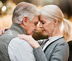 Love, forehead or face of senior couple bonding, slow dance and enjoy quality time together in park, forest or woods. Wellness, nature or elderly people care, support or connect on relax outdoor date