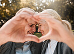 Love, park and senior happy couple with heart hands for retirement health, marriage bond and romantic date symbol. Support, emoji icon and outdoor man, old woman or people smile for nature wellness