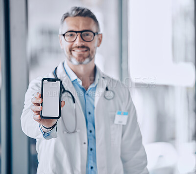 Buy stock photo Doctor, phone screen and mockup for healthcare presentation, communication or FAQ in hospital. Medical portrait of man with mobile app, advertising or ux design space for contact us or clinic sign up