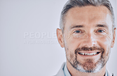 Buy stock photo Doctor man, headshot and space with smile in portrait, mockup or promotion for hospital employee. Healthcare professional, expert and mature leader with face by wall background for wellness in clinic