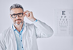 Portrait, glasses and eye exam with an optometrist man in his office for healthcare or vision improvement. Medical, frame and eyewear with a doctor or optician in a clinic for assessment and testing