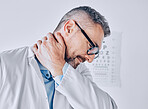 Healthcare, neck pain and optometry with a doctor in his office for an eye exam while feeling stress. Medical, burnout or accident with a mature optician holding his spine or shoulder in a clinic