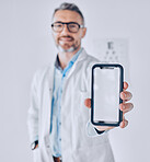 Phone, screen and optometrist in eye exam, test or booking an assessment for vision with mobile app, internet or website. Cellphone, mockup and doctor testing eyesight in office with technology