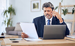 Document, laptop and businessman on a phone call in the office while talking to a client. Discussion, technology and mature professional male lawyer on mobile conversation with paperwork and computer