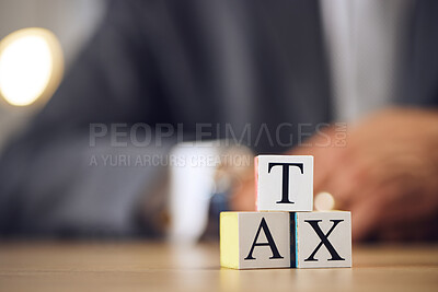 Buy stock photo Business person, hands and blocks for tax, financial advisor or accounting on office desk. Letter or word of finance accountant, lawyer or real estate in revenue, property investment or loan income
