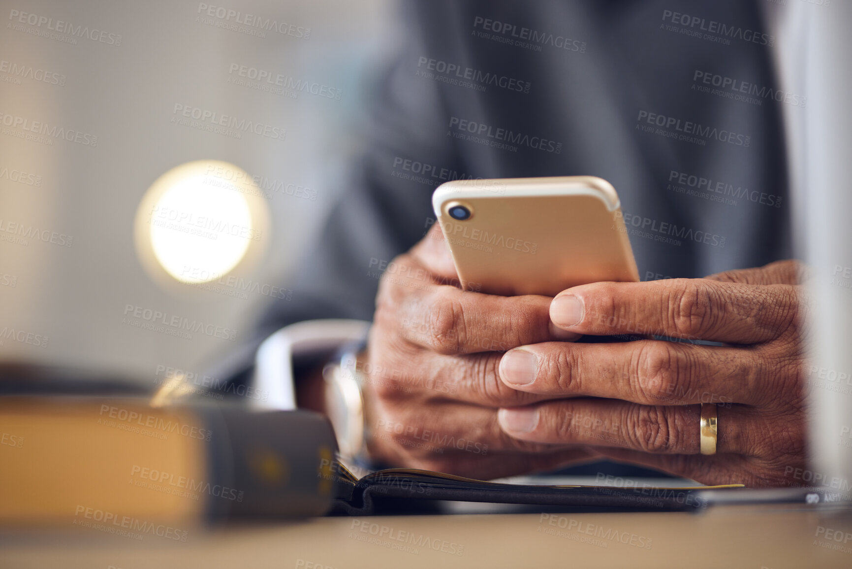 Buy stock photo Closeup hand, typing and a person with a phone for communication, email check or contact. Desk, work and a man with a mobile in an office for an online app, connection and reading a notification