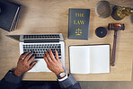Above, hands and laptop typing for law, planning justice or working at a desk in an office. Attorney, email and a lawyer or legal employee with a computer at a table for connection and communication