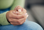 Anxiety, hands and woman with depression, scared and mental health crisis in her home. Fear, zoom and female with nails scratch habit from stress, trauma or abuse disaster, addiction or mistake fail