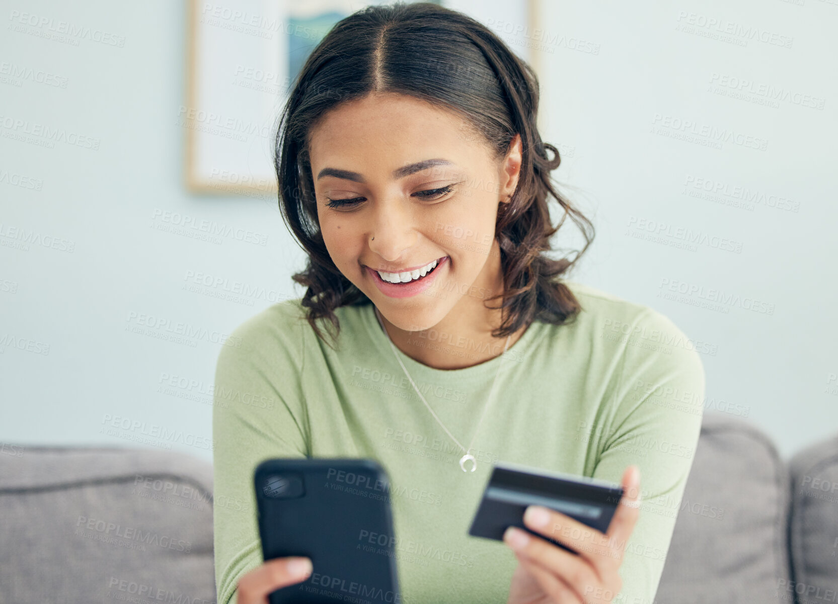 Buy stock photo Credit card, phone and woman on a sofa happy for cashback, savings or ecommerce sale in her home. Smartphone, and female customer in a living room smile for sign up, survey or bank, payment or budget